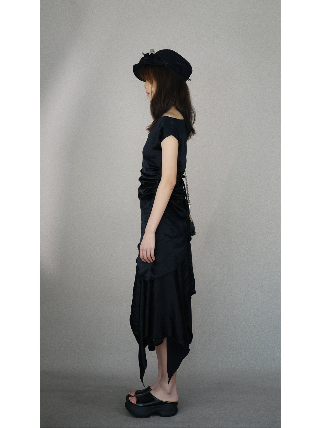 Saucer-wing skirt dress with a slanted neckline